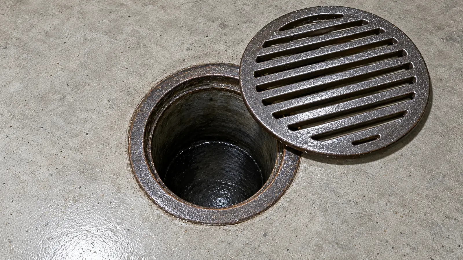 After: the same floor drain clean and clear