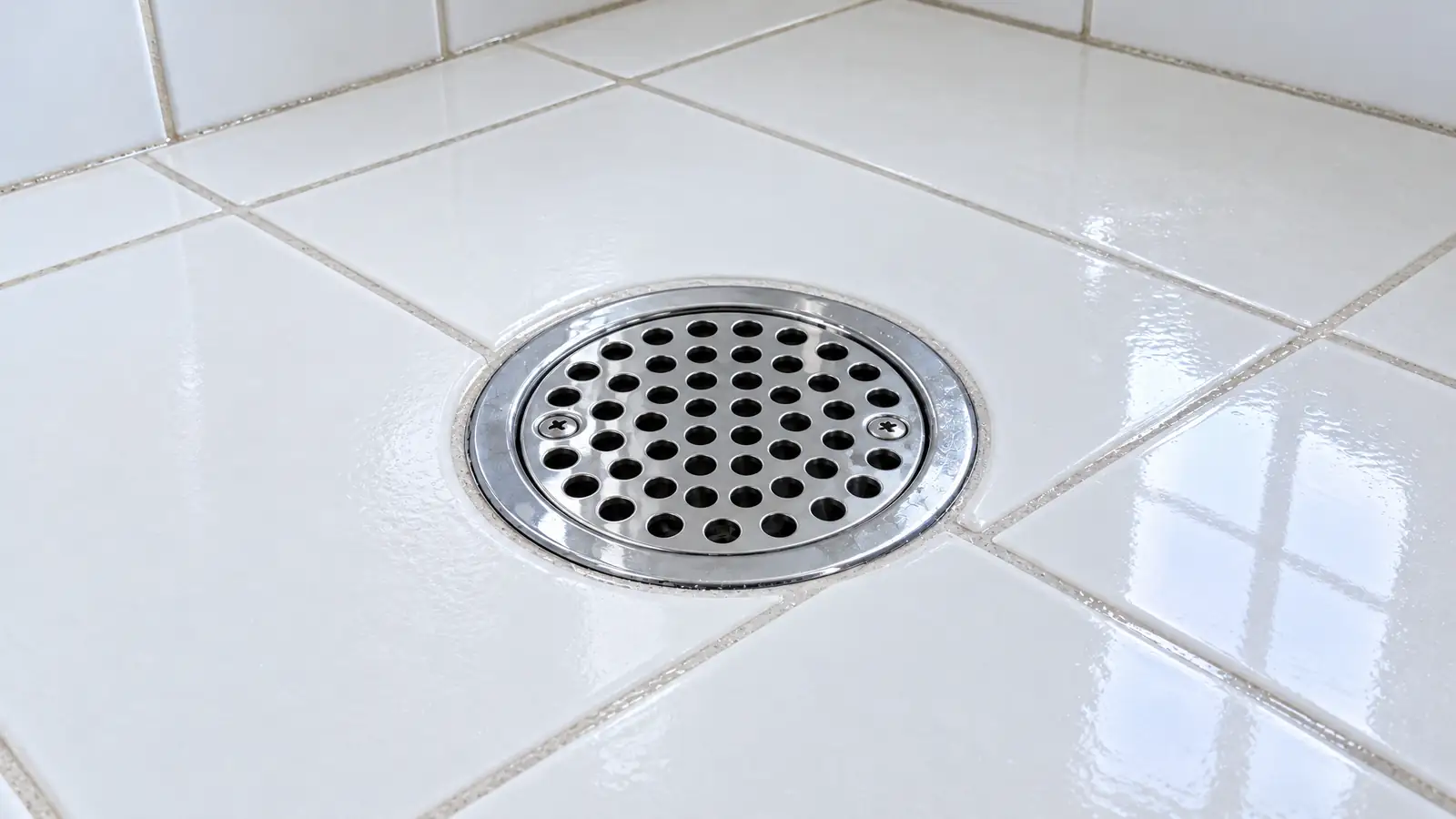 After: the same chrome drain clean and open